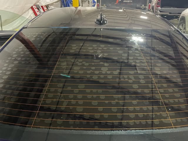 Close-up of a flawless rear window tint installation